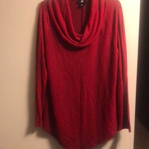 Super soft cowl neck sweater with pointed hem.